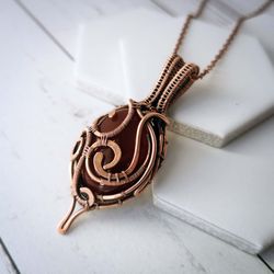 wire wrapped copper pendant with red carnelian stone. wire weave carnelian necklace. unusual handcrafted gift.