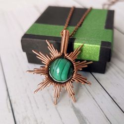 sun necklace with malachite bead. wire wrapped copper pendant with malachite.