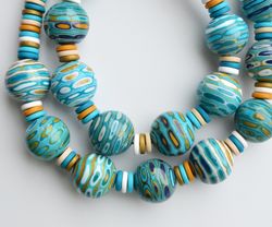 Turquoise blue striped statement necklace of polymer clay. Large beaded necklace. Gold blue white statement necklace