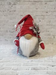 The Northern gnome. Scandinavian gnome. Winter holiday gnome. Christmas ornament. Tomte. A Christmas present. The Christ