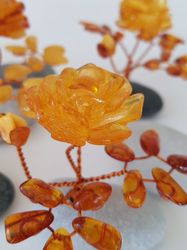 Rose. Rose amber.Decorative flowers.A souvenir made of stone.