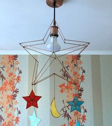Star lamp in the children's room with stained glass stars