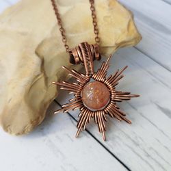 star necklace with sunstone. wire wrapped copper pendant with sunstone bead.