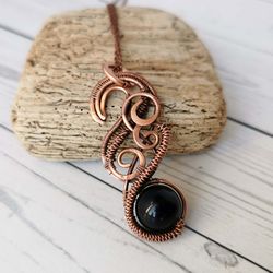 black obsidian necklace. wire wrapped copper pendant with black obsidian bead.