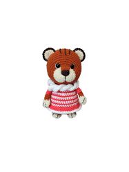 Ginger brown crocheted teddy plush tiger in pink dress, interior toy