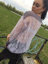 The gossamer sweater is thin, airy, loose