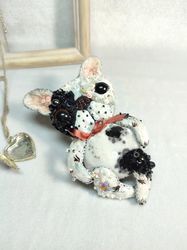 Embroidered brooch or pendant on a chain white French bulldog Tail.