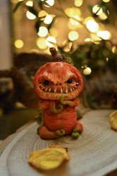 Scary pumpkin. Collectible toy made of polymer clay.