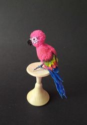 miniature crocheted amigurumi parrot toy