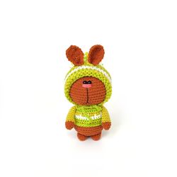 Red rabbit in a hat is a symbol of 2023, bunny Christmas gift, interior toy