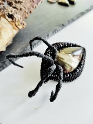 Embroidered beaded brooch. Evil eye, spider paws, black beaded jewelry, natural stone brooch for men and women