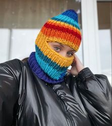 Women's knitted striped balaclava made of thick yarn.