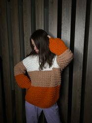 Knitted Warm women's sweater made of thick yarn