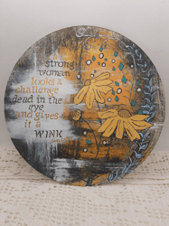 Hand painted acrylic sign on 10 inch round craft wood with strong woman quote and flowers