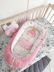 Baby  nest  for  newborn.  Pillow as  a  gift