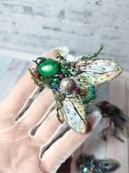 Embroidered green fly brooch with natural pearls and natural stones.