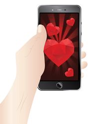 Lovely Valentines day greetings with red heart on phone display