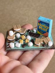 Miniature set - marshmallows and cookies on a tray with a chocolate bar