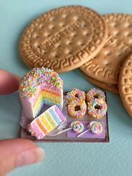 Miniature rainbow cake set with donuts on a tray for playing with dolls, dollhouse, scale 1:12, miniature pastries