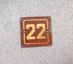 Red gold glass apartment 22 door number sign square shape