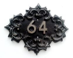 Vintage cast iron address number plaque 64 old fashioned door sign