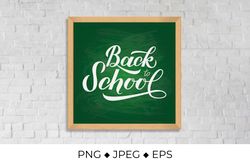 Back to school calligraphy hand lettering on green board with wooden frame
