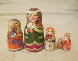 Musical Russian nesting dolls matryoshka - Beautiful winter dressed traditional Russian girls with musical instruments