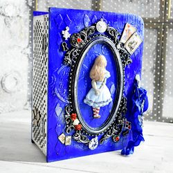 a blue book-box with  alice in wonderland