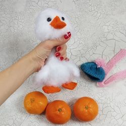White stuffed duckling with bendable feet, plush fluffy goose, stuffed toy fluffy duckling