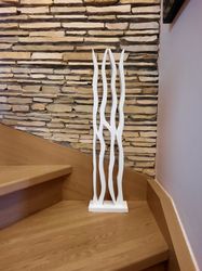 White noise. White wooden sculpture. Abstract sculpture.