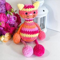 Crochet animal. Plush cat colorful