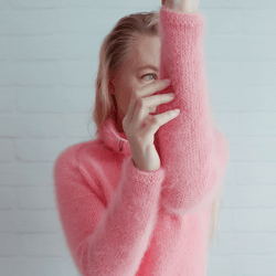 Delicate, warm and fluffy knitted angora turtleneck sweater in pink.