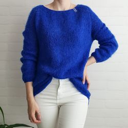 Warm knitted jumper made of Italian mohair in bright blue color with lurex.
