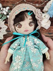 Handmade crochet amigurumi doll toy.