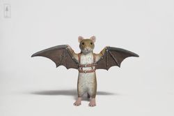 flying mouse figurine