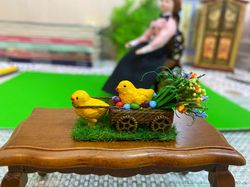 Easter miniature. Two chickens with a cart and a bouquet of flowers.1:12