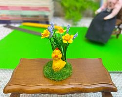 Easter miniature.Chicken on a stand.