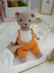 Spring teddy bear knitting pattern. Stuffed knitted doll
