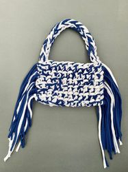 Crocheted baguette bag with metal clasp and long fringe