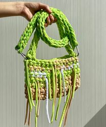 Crocheted baguette bag with metal button clasp and long adjustive strap