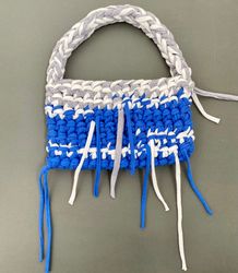 Crocheted baguette bag with metal button clasp