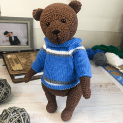 Teddy bear, knitted bear, bear in a blue sweater