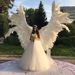 giant angel wings wedding backdrop on metal stand, luxury street party decoration
