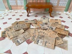 Old sheets of newspaper. 1:12.