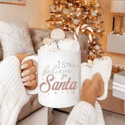 i still believe christmas campfire mug, coffee lover christmas mug gift, holiday mugs, cute winter mugs, aesthetic chris