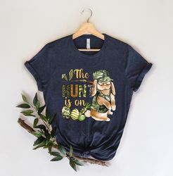 The Hunt Is On Shirt, Christian Easter Shirt, Easter Carrot and Camouflage Eggs Shirt, Easter Shirt Gift for Women,Hunte