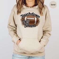 leopard print football graphic hoodies for women, football season gifts, football player long sleeve shirts, football cr