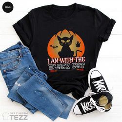 Black Cat Halloween Shirt, Funny Halloween Shirt, I am With the Black Cat Shirt, Halloween Cat Shirt, Hocus Pocus Cat Lo