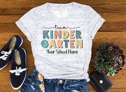 Team Kindegarten Personalized Tee, Back To School Teacher Shirt, Kindergarten Teacher Unisex V Neck Graphic Tee T-Shirt