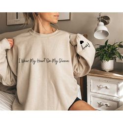 I Wear My Heart On My Sleeve Crewneck or Hoodie, Custom Mama Sweatshirt with Children Name on Sleeve, Mothers Day, Gift